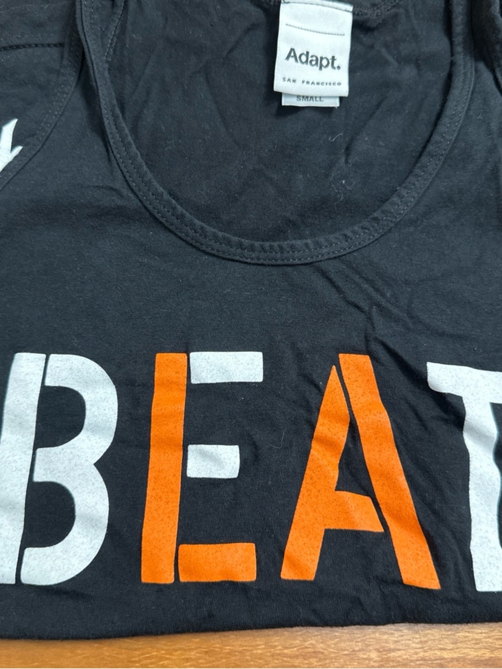 Adapt Black Tee with White Brand Tag Detail